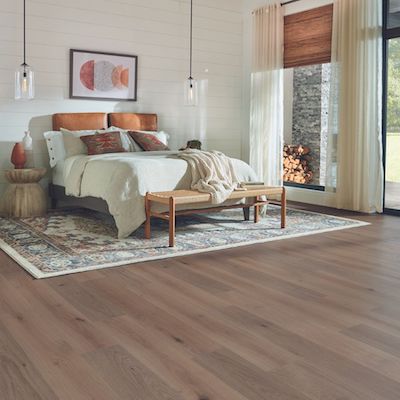 wood look laminate flooring in a rustic bright bedroom